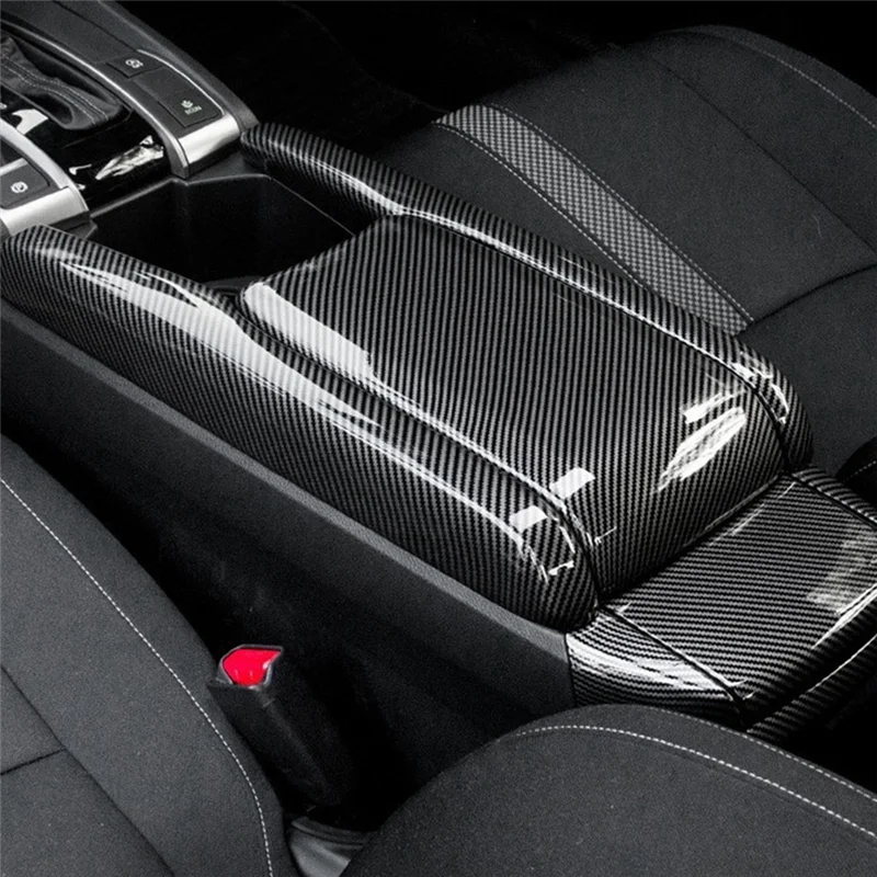 Close-up of a black custom armrest box cover for a Honda Civic, featuring textured leather upholstery.