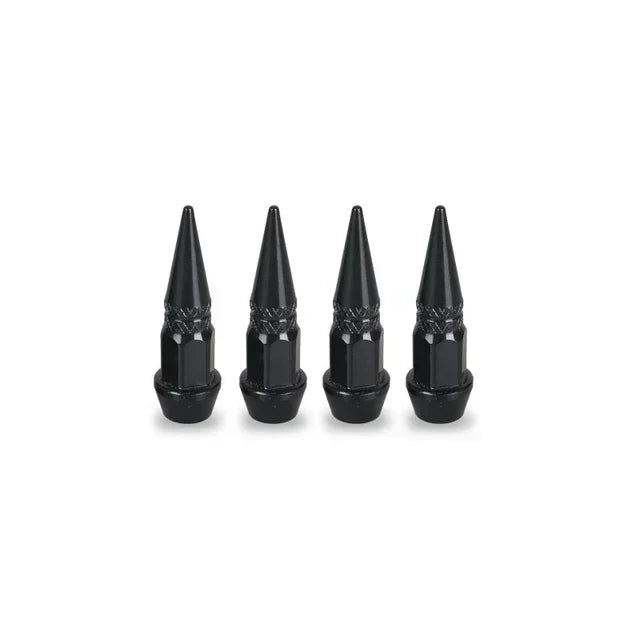 A set of four black aluminum tire valve stem caps.