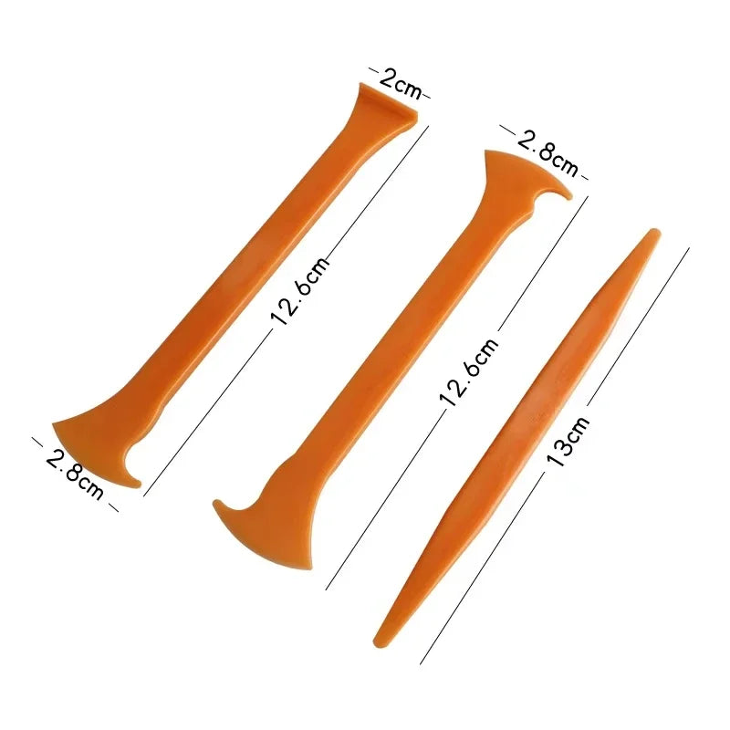 Orange vinyl car wrap tool kit showing various sized plastic tools for applying vinyl wraps