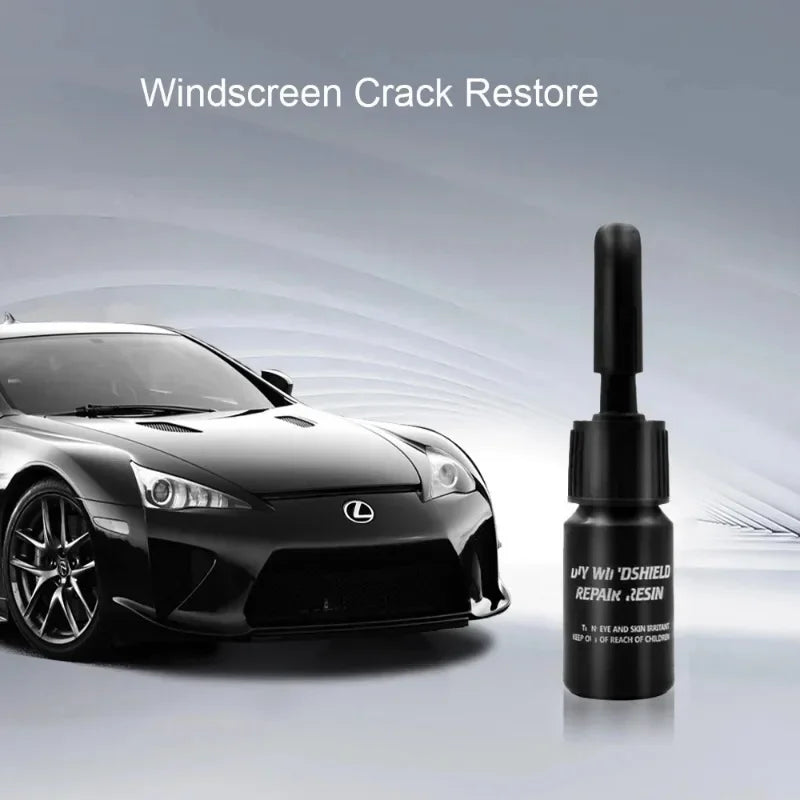 Eine Flasche Windscreen Crack Restore Harz neben einem schwarzen Lexus Sportwagen.