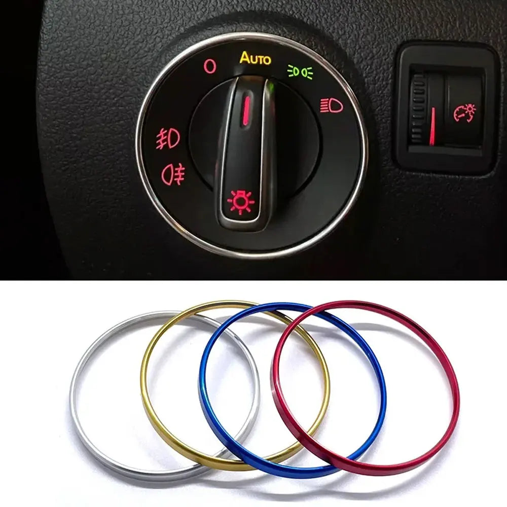Set von vier bfarbigen Metallringen (silber, gold, blau, rot) als Zierleiste für Auto-Scheinwerfer-Schalter.