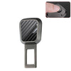 A close-up view of a car seat belt extender with a quick-release buckle, featuring a textured black and gray finish.