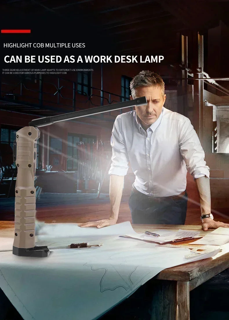 A man is using a highlight cob light as a work desk lamp on a wooden table.