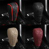 Close-up view of an artificial leather handbrake cover in black and red colors.