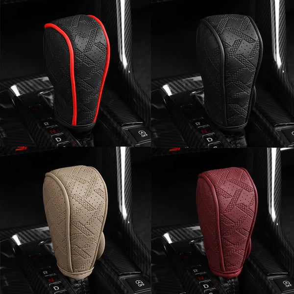 Close-up view of an artificial leather handbrake cover in black and red accents, shown on a car interior console.