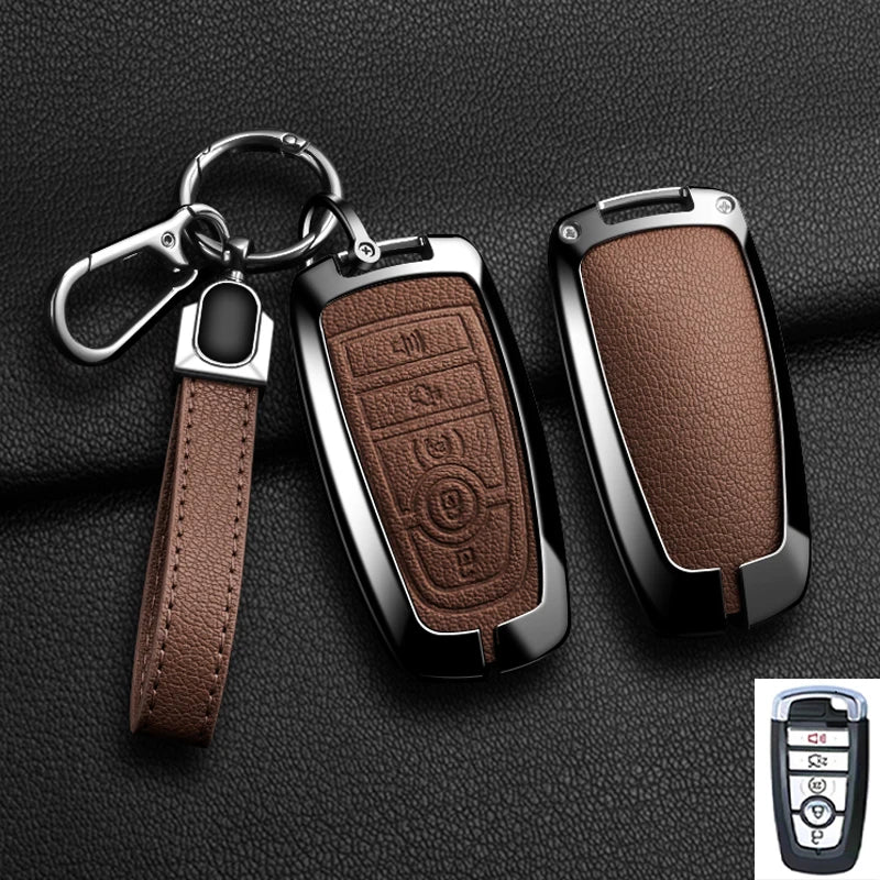 A brown leather strap attached to an aluminum alloy key fob cover for a Ford vehicle.