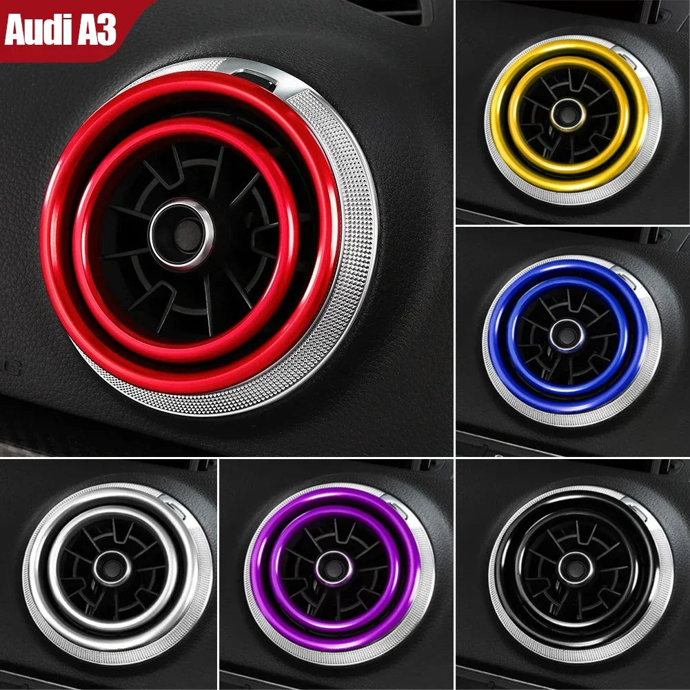 Close-up view of various colored interior air vent trim covers for an Audi A3 car