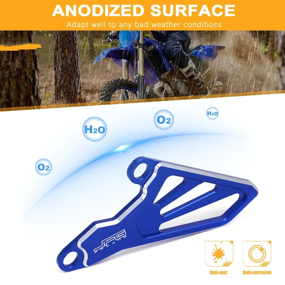 Blue anodized aluminum front sprocket cover for dirt bikes, showing anti-rust and anti-corrosion features.