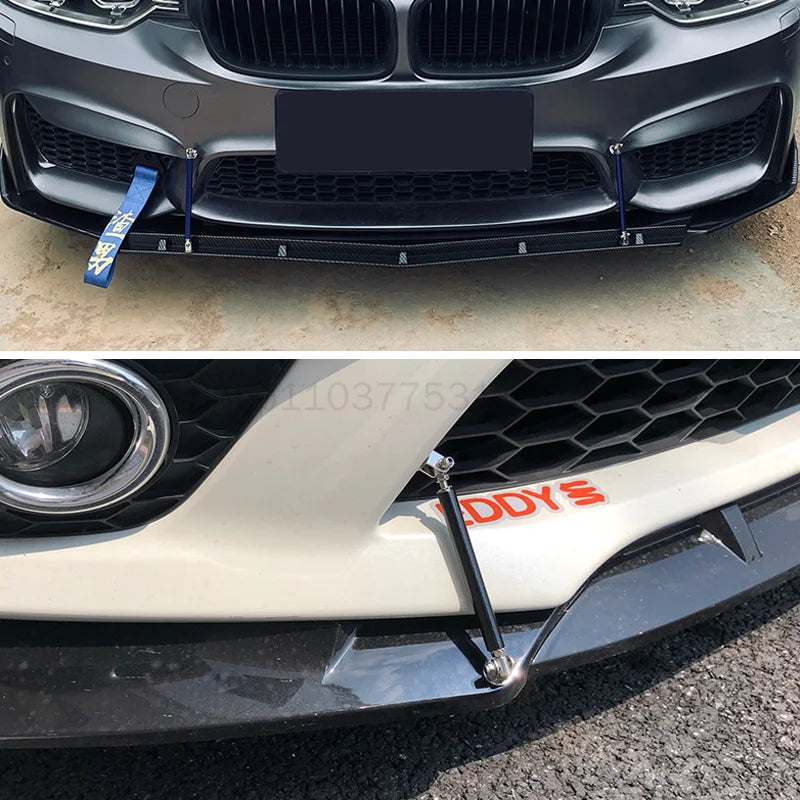 Close-up of a black car bumper with blue adjustable splitter rods installed.