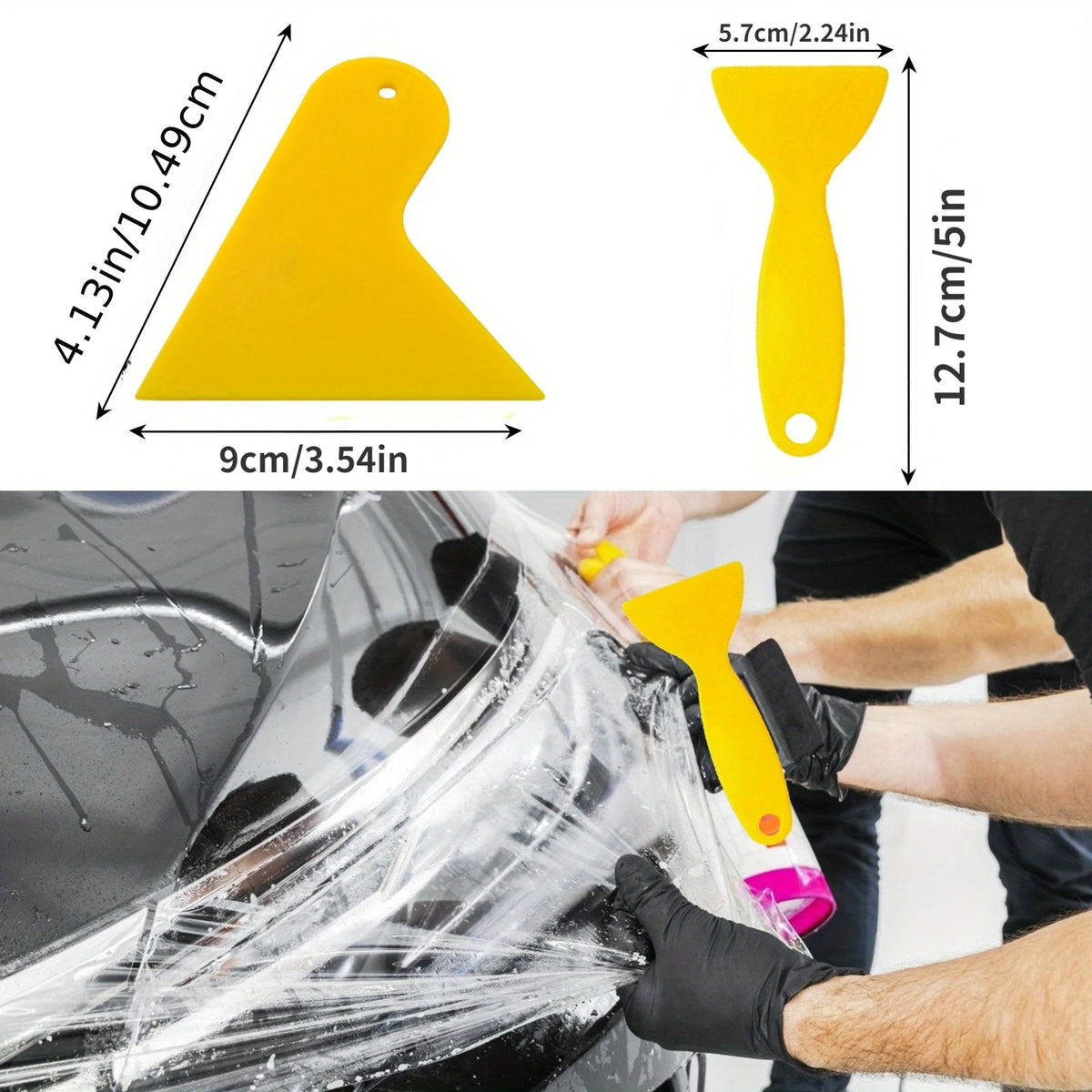 A hand is using a yellow squeegee tool to apply window tint film onto a car surface.