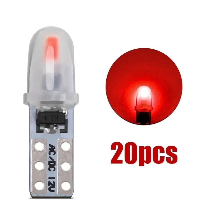 A set of 20 T5 LED dashboard and license plate bulbs with silver bases and red light elements.