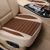 Tan car seat covers with brown accents shown inside a vehicle cabin.