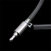 A close-up view of a metal brake fluid bleeder hose kit with a flexible tube attached against a black background.
