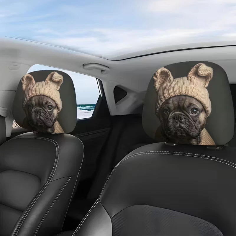 Two dog-themed car headrest covers featuring pug faces on a black car interior.