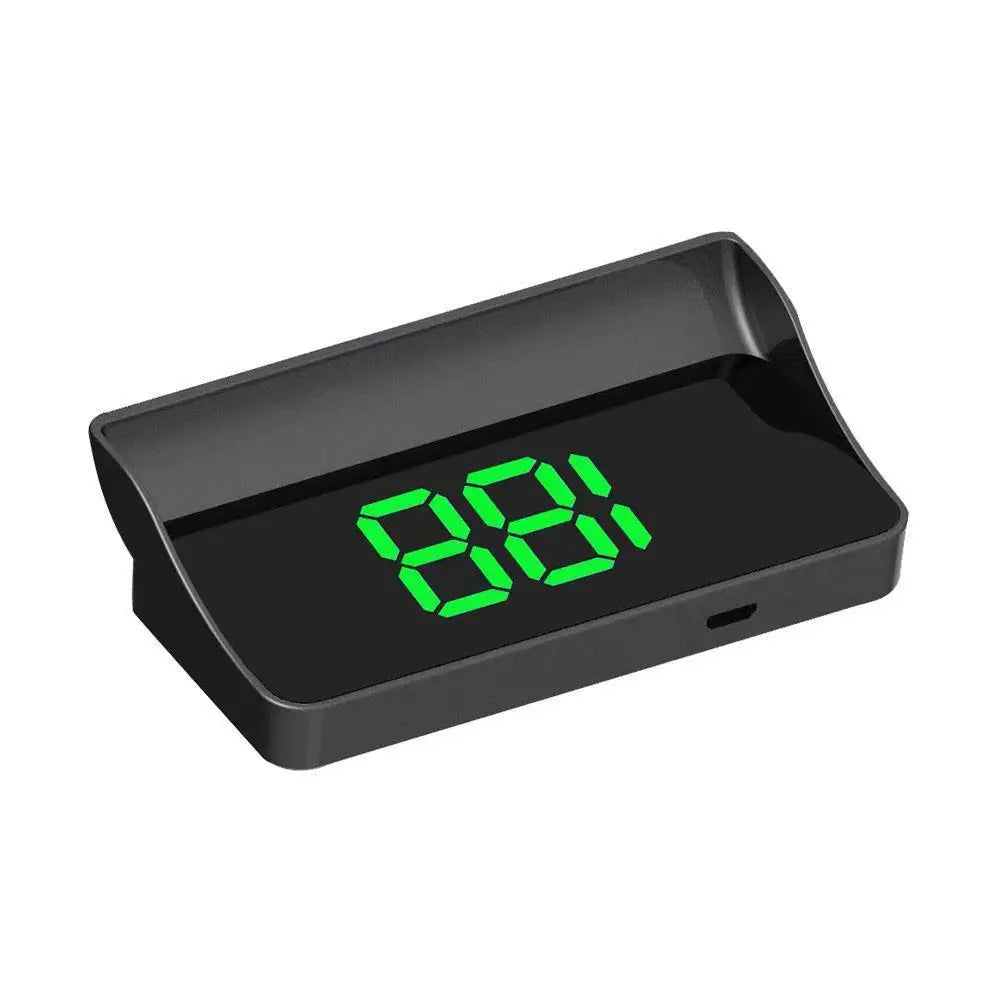 A black car dashboard speed and GPS display unit with a green digital readout.