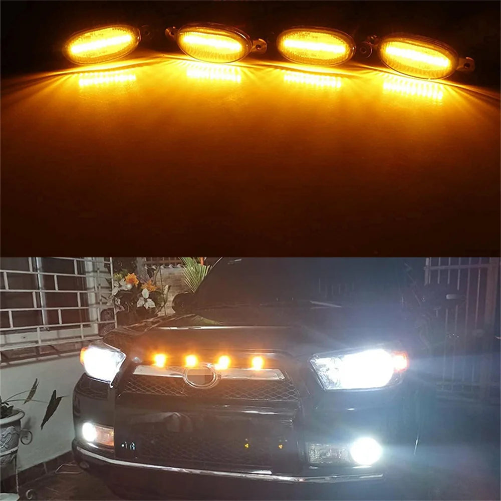 Luces marcadoras LED de liquidación instaladas en la parrilla de una camioneta o SUV negra.