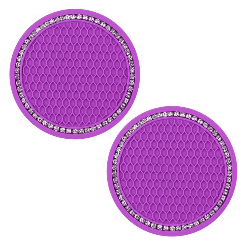 A set of purple hexagonal silicone coasters decorated with clear rhinestones.