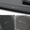 Close-up view of a black leather car audio emblem with the Chevrolet logo on a panel.