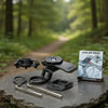 A black universal motorcycle phone mount is displayed on a stone, next to its packaging.