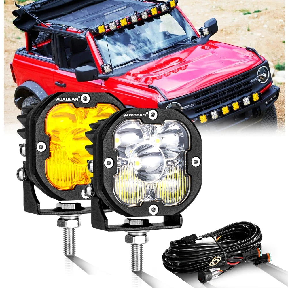 A red off-road vehicle with aftermarket LED driving lights installed on the front bumper.
