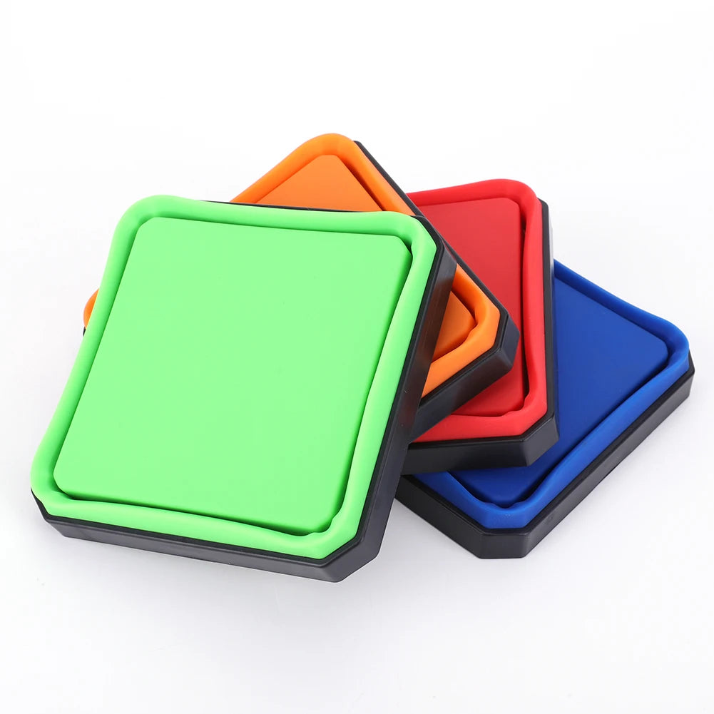 A set of colorful collapsible magnetic parts trays, including green, orange, red, and blue.