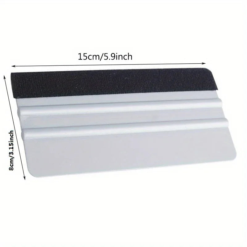 A precision scratch-free decal applicator tool with a black top and multiple white strips for applying decals.