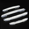 A set of four clear plastic car door edge protector strips for anti-scratch guard trim.