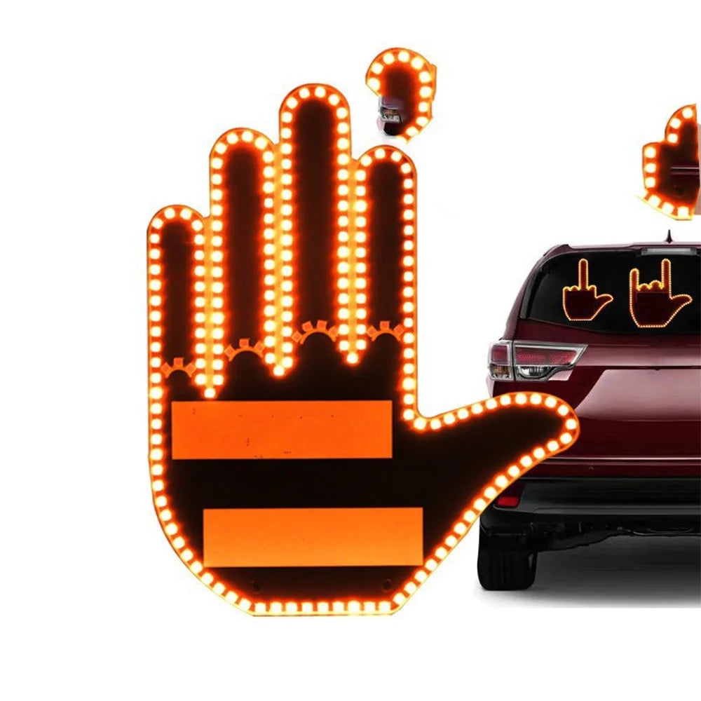 An orange LED hand light illuminates a remote control car in the background.