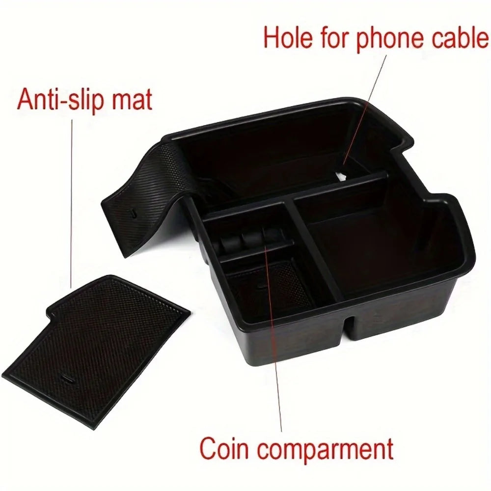 Black convertible armrest storage tray with an anti-slip mat, phone cable hole, and coin compartment.