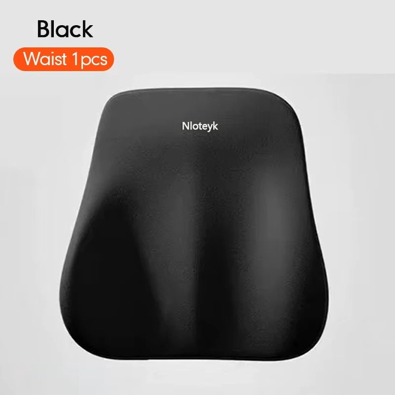 A black ergonomic lumbar support pillow shown against a light gray background.