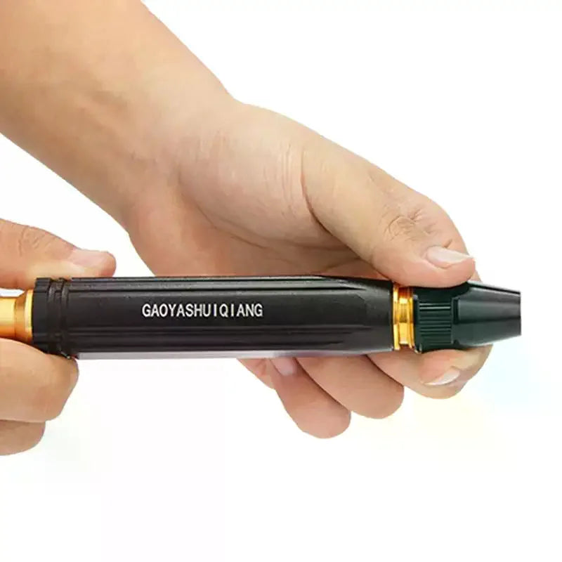 A hand holds a black and gold heavy duty 4-in-1 high-pressure water spray and watering kit.