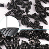 A close-up view of black car tyre puncture repair kit components, including a needle and various repair elements.