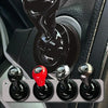 Close-up of a universal metal engine start lever decoration with various finishes shown in a car interior context.