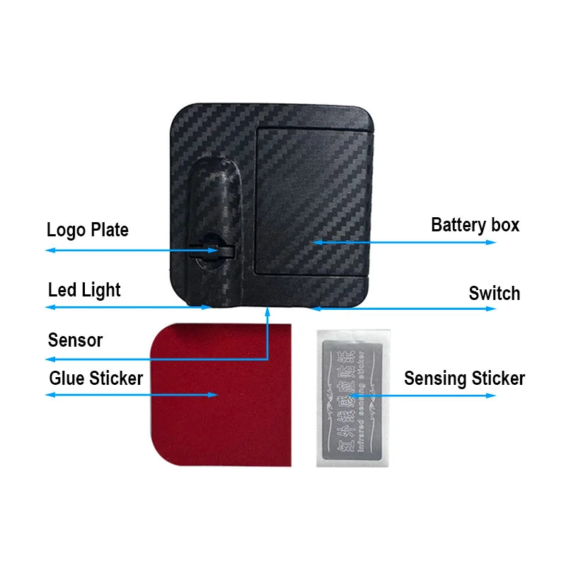 Boîte à batterie noire avec composants variés : plaque de logo, LED, interrupteur et autocollant de détection.