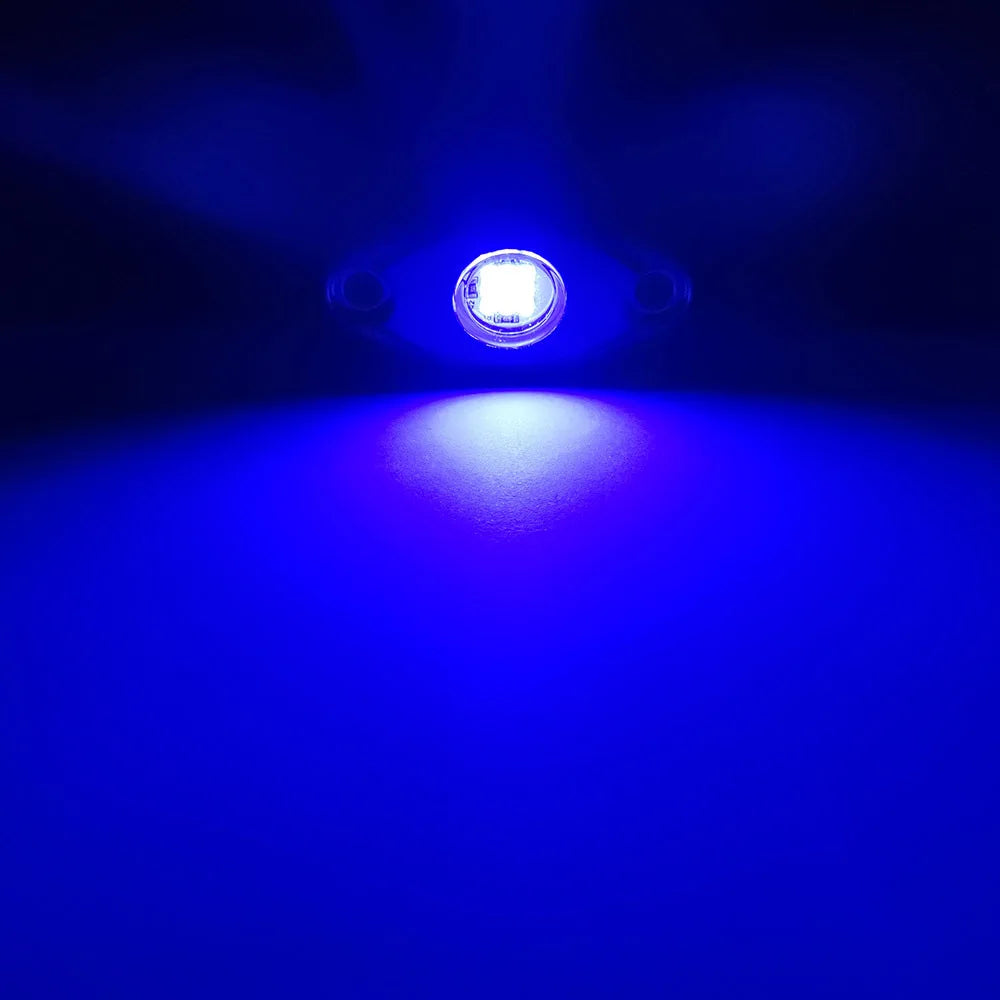 A close-up shot of a bright white LED light shining forward, illuminating a blue surface.