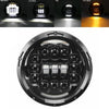 A close-up view of a 7 inch motorcycle LED headlight assembly with multiple projector lenses.