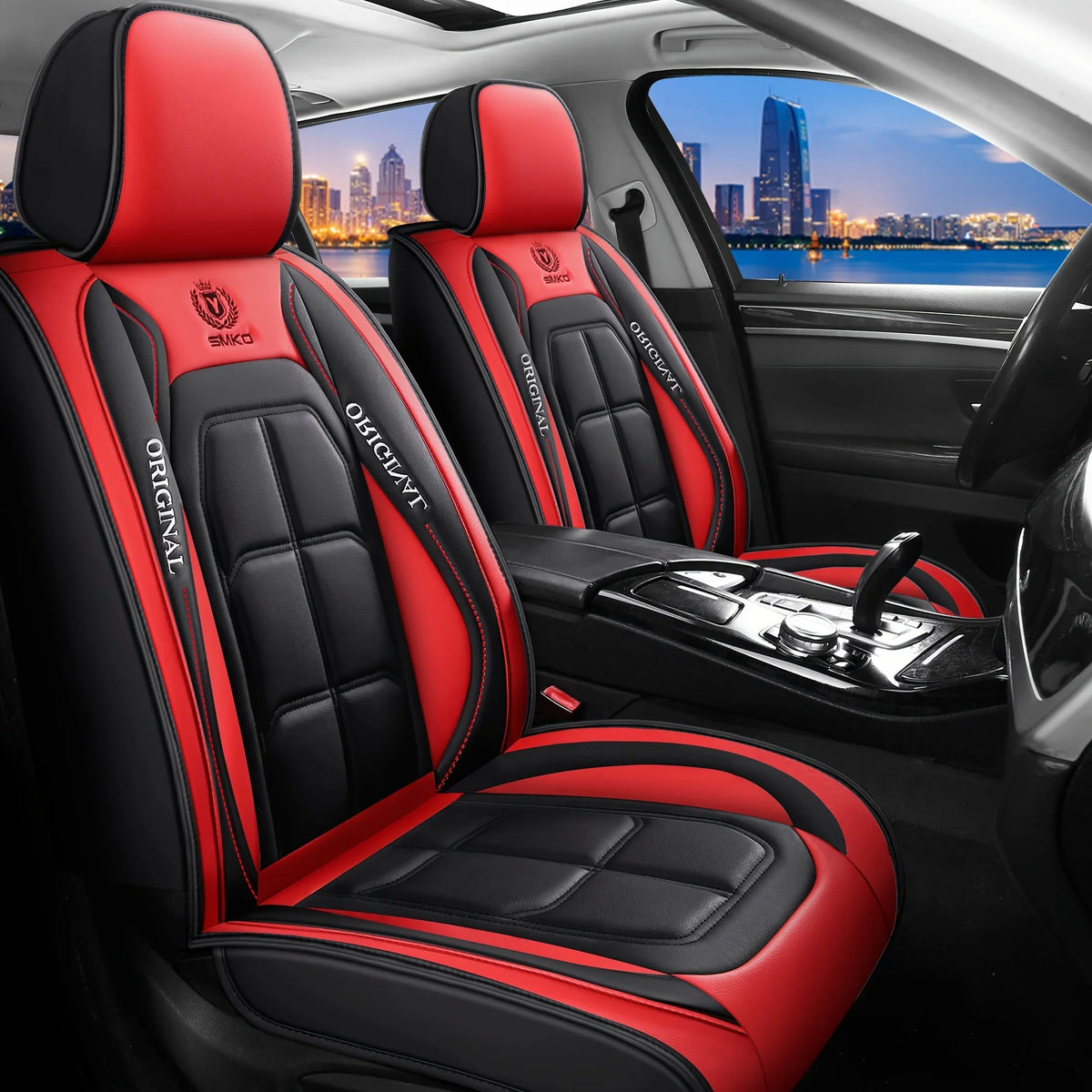 Red and black leather car seat covers with stitching and accents shown inside a vehicle.