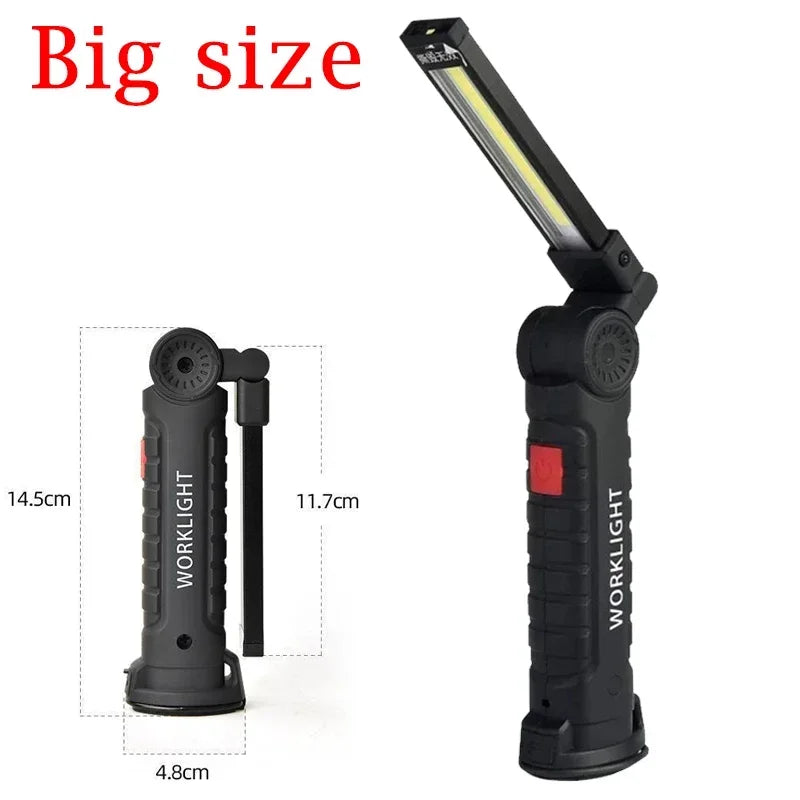 A black foldable magnetic LED flashlight with a yellow light, shown in a vertical orientation.