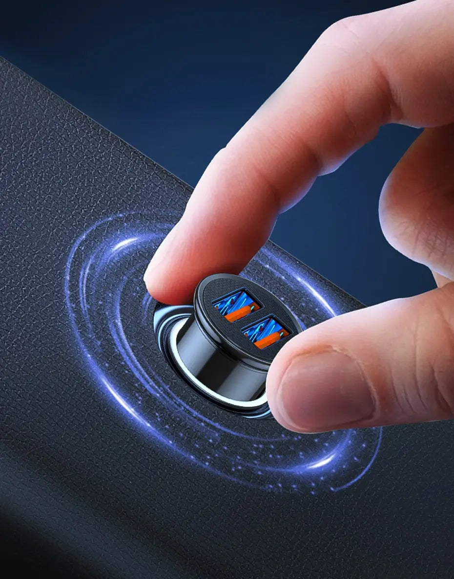 A hand is pressing a dual port car charger into a device, showing a blue energy ring effect on the surface.