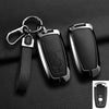 A black aluminum alloy key fob cover for a Ford vehicle, shown with its attached chain and strap.