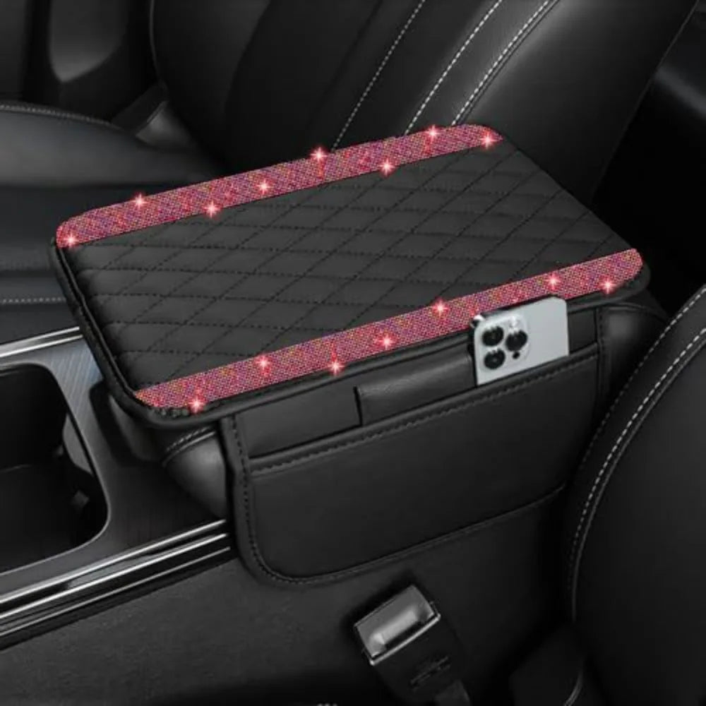 A black car console cover with a diamond grid pattern and pink glitter accents is shown inside a vehicle.
