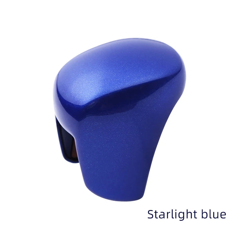 A close-up view of a Starlight blue ABS interior knob gear protection cover.