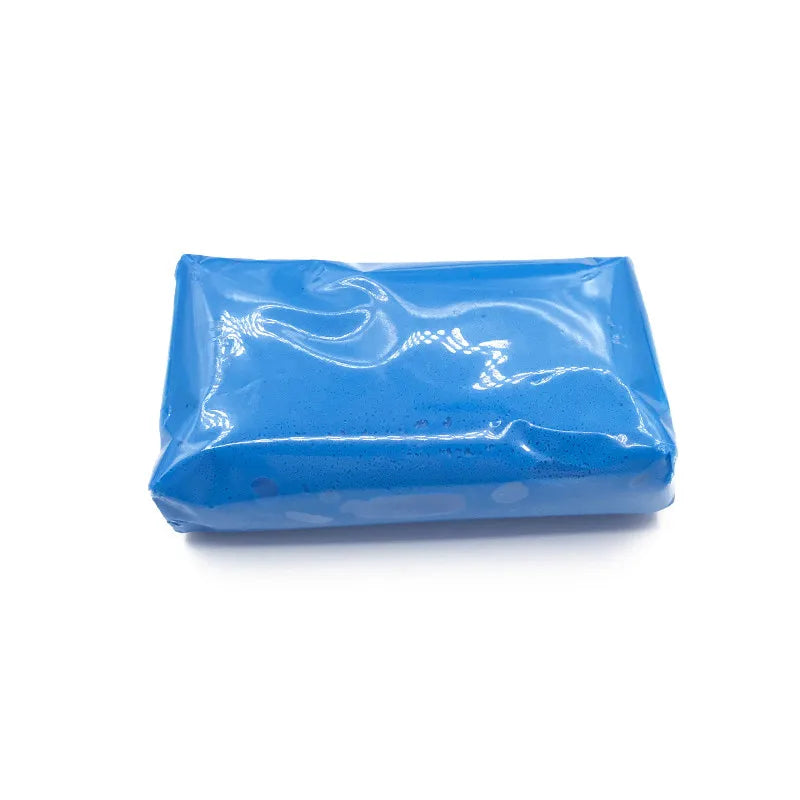A rectangular bar of blue magic clay used for auto detailing
