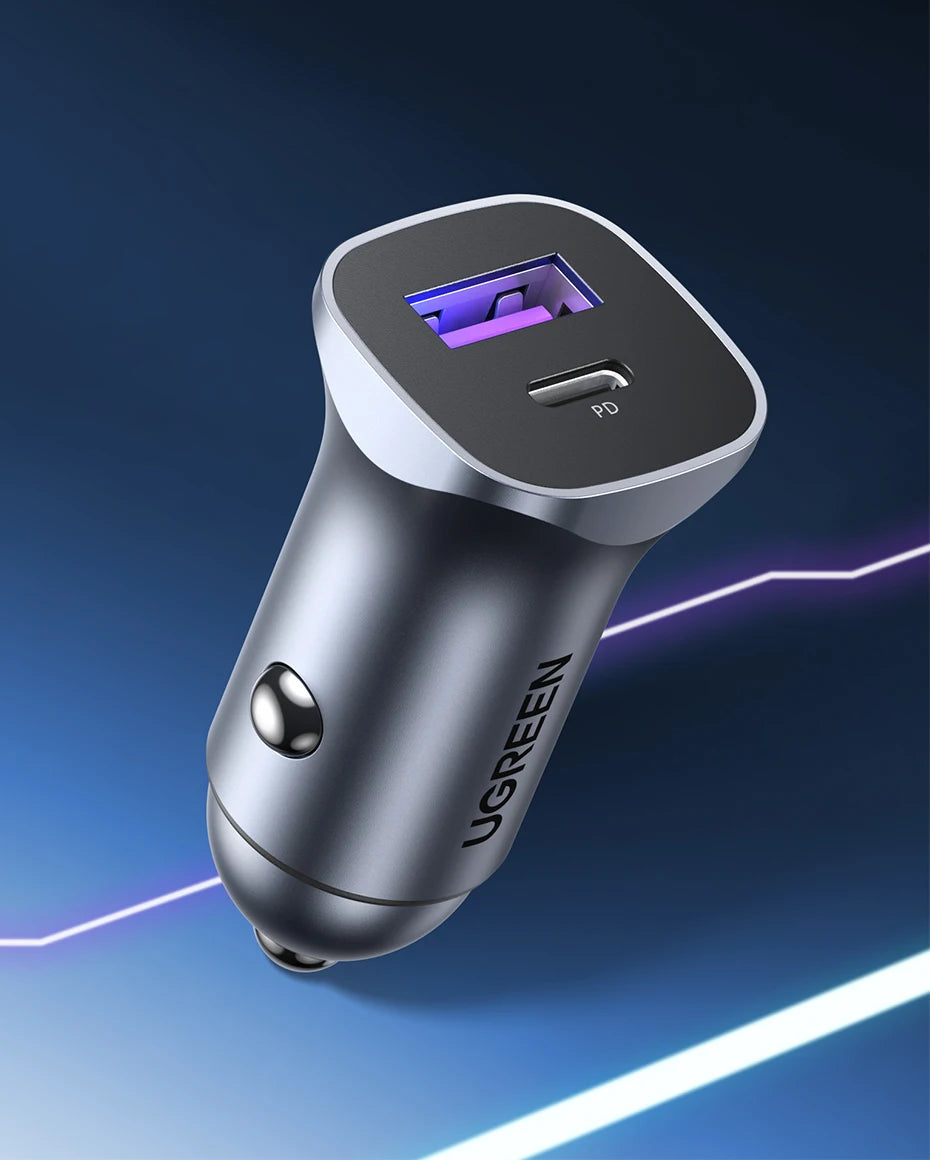 A silver UGREEN 30W dual-port USB-C fast car charger with a purple LED indicator.