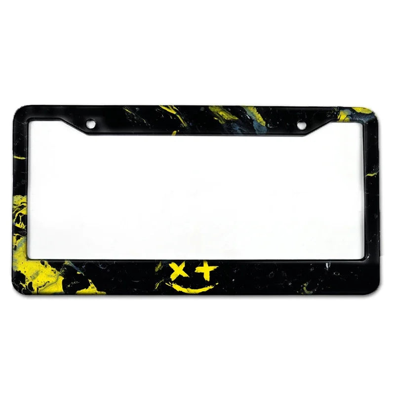 Black and yellow marbled aluminum license plate frame with a smiley face design