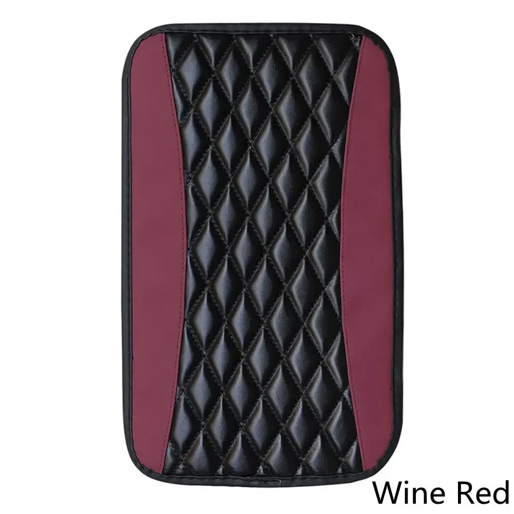 A black and maroon quilted pad designed to protect a car armrest.