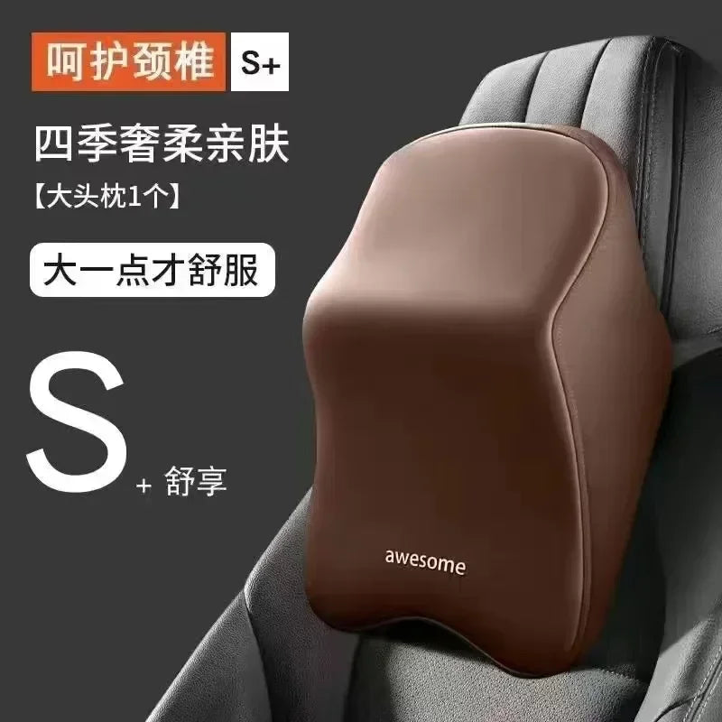 A brown ergonomic car headrest cushion with a smooth, rounded design is shown in a dark gray car seat context.