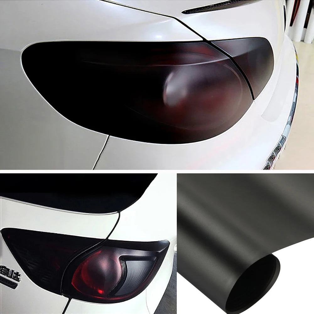Close-up view of a black smoke tint vinyl decal applied to a car's taillight lens.