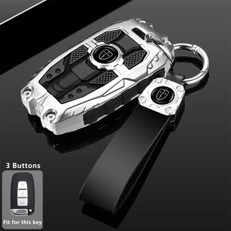 Silver car key fob cover with a black protective case and attached lanyard.