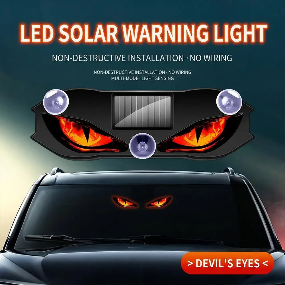 ضوء تحذيري شمسي LED مثبت على سيارة، يظهر عيونًا حمراء متوهجة.